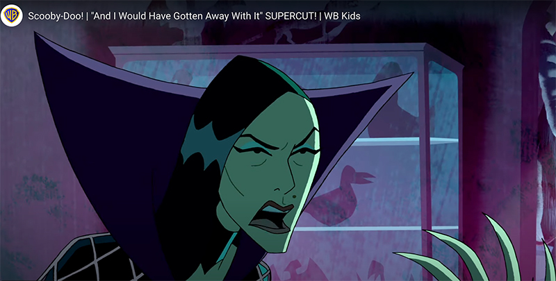 Image of evil witch with spiny fingers, green face, and black cloak from Scooby Doo